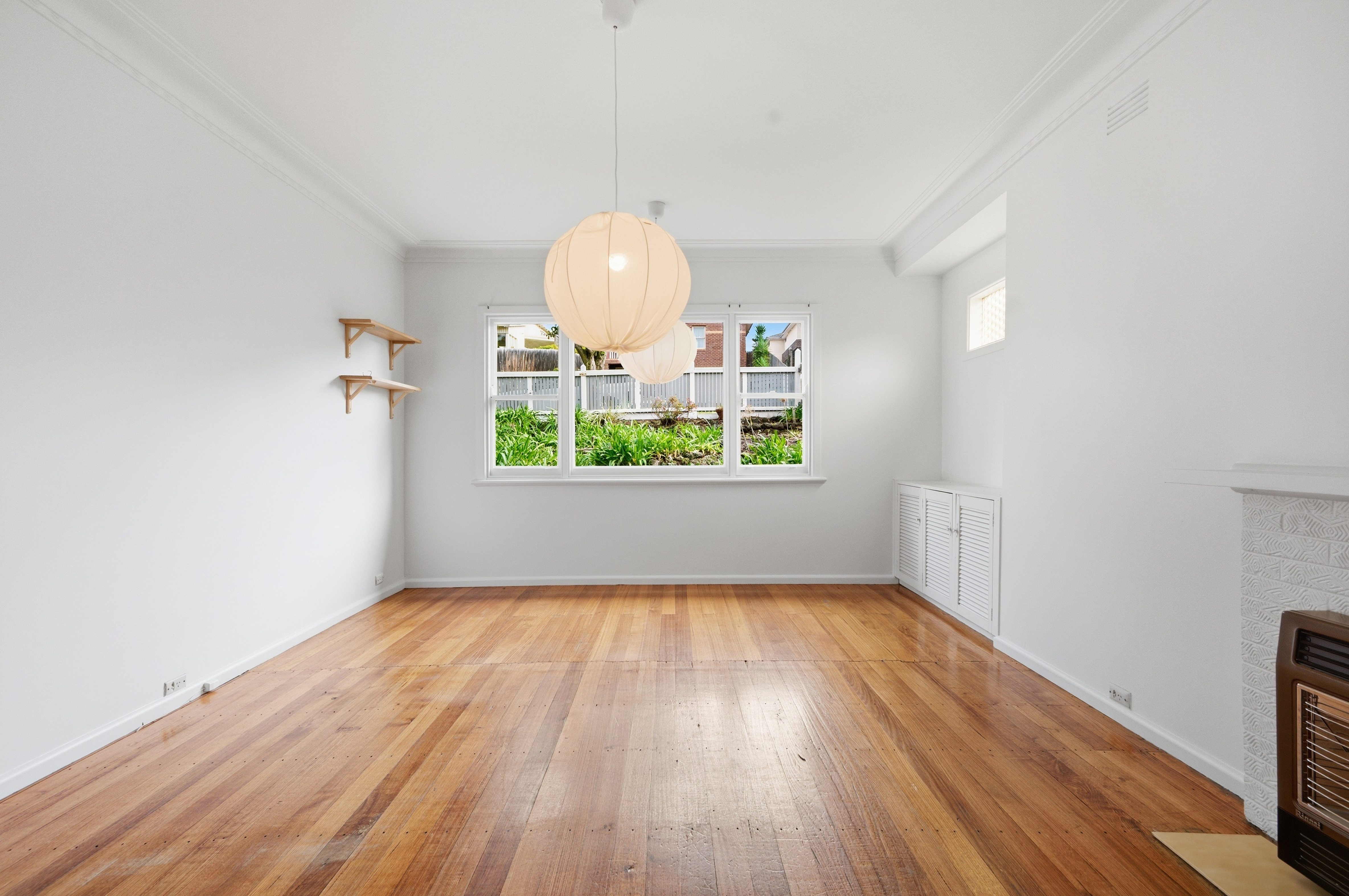 Before virtual furniture staging: vacant compact room in Australian residential listing