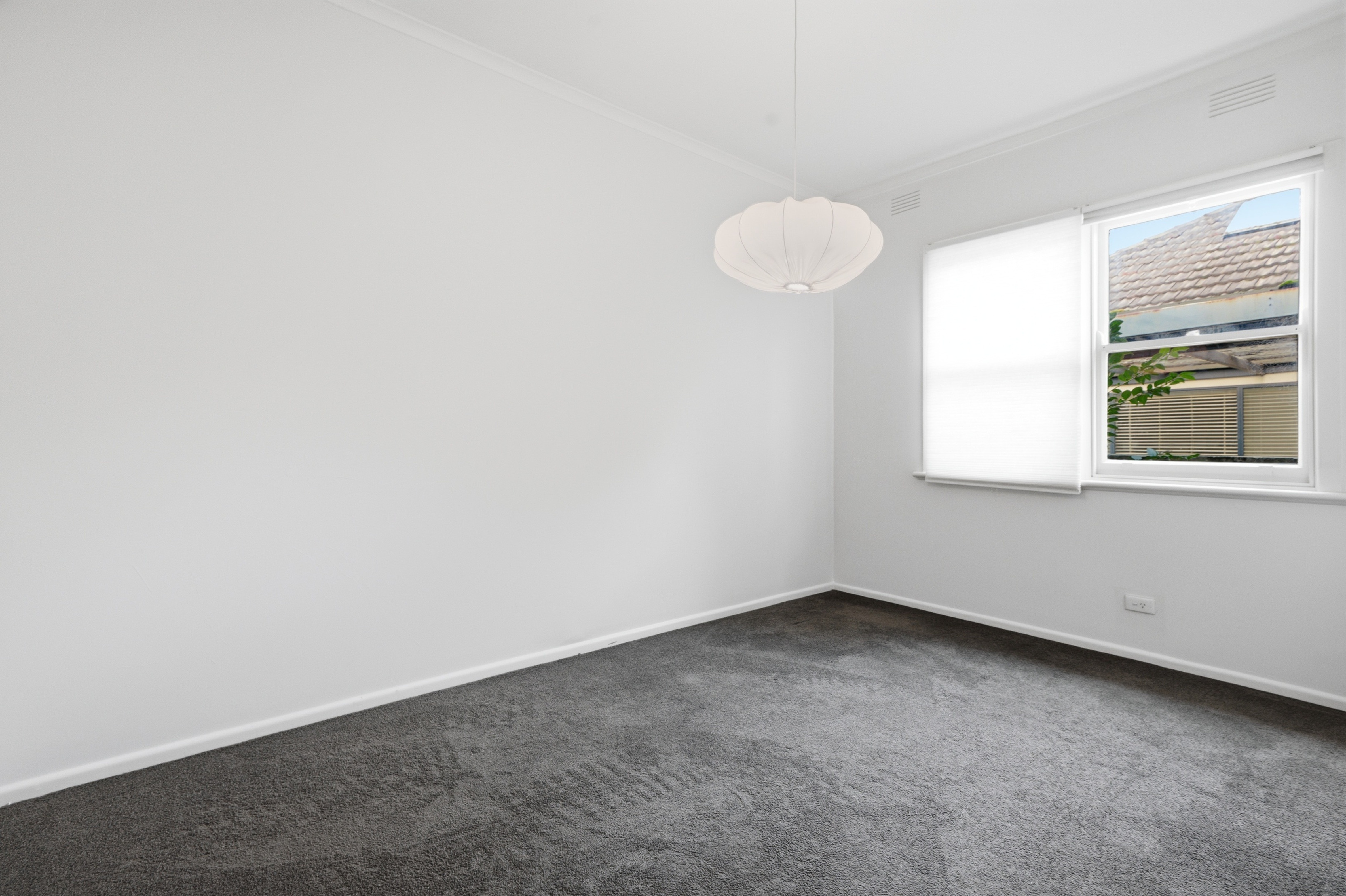 Before digital staging: unfurnished family living space before real estate listing presentation